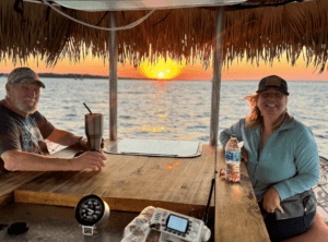 Guests enjoying the sunset on our Tiki boat