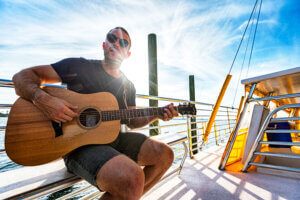 Musician on sunset sail