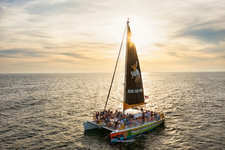 SV Privateer sailing in the Gulf of Mexico during sunset