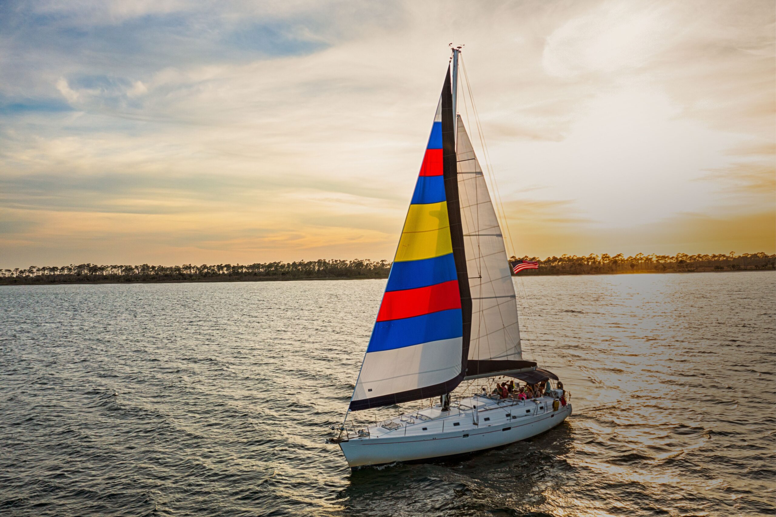 SY Ohana sailing at sunset past Shell Island, Panama City Beach FL